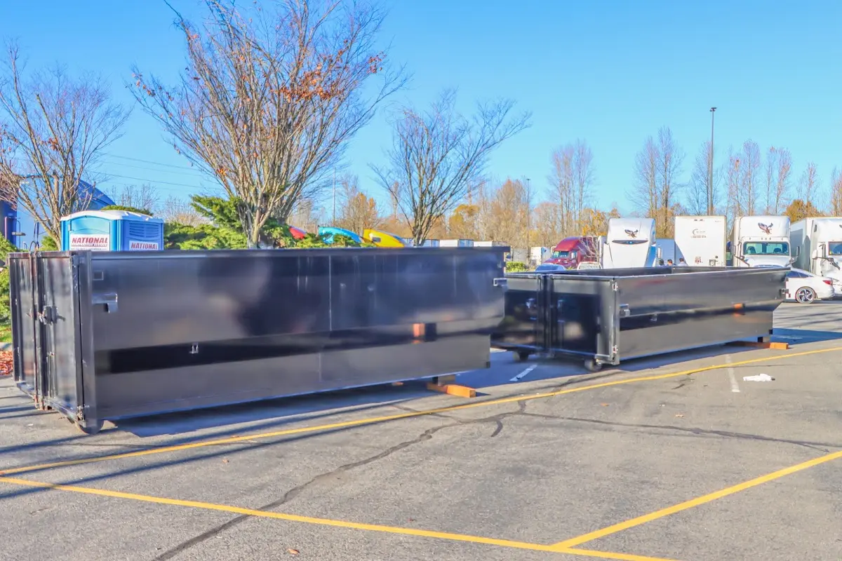 Professional dumpster rental service with roll-off container on residential driveway in Seaford